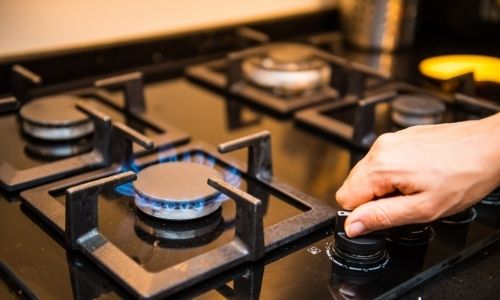 How to clean black enamel gas stove top